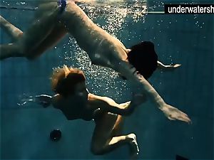 two wondrous amateurs showcasing their figures off under water